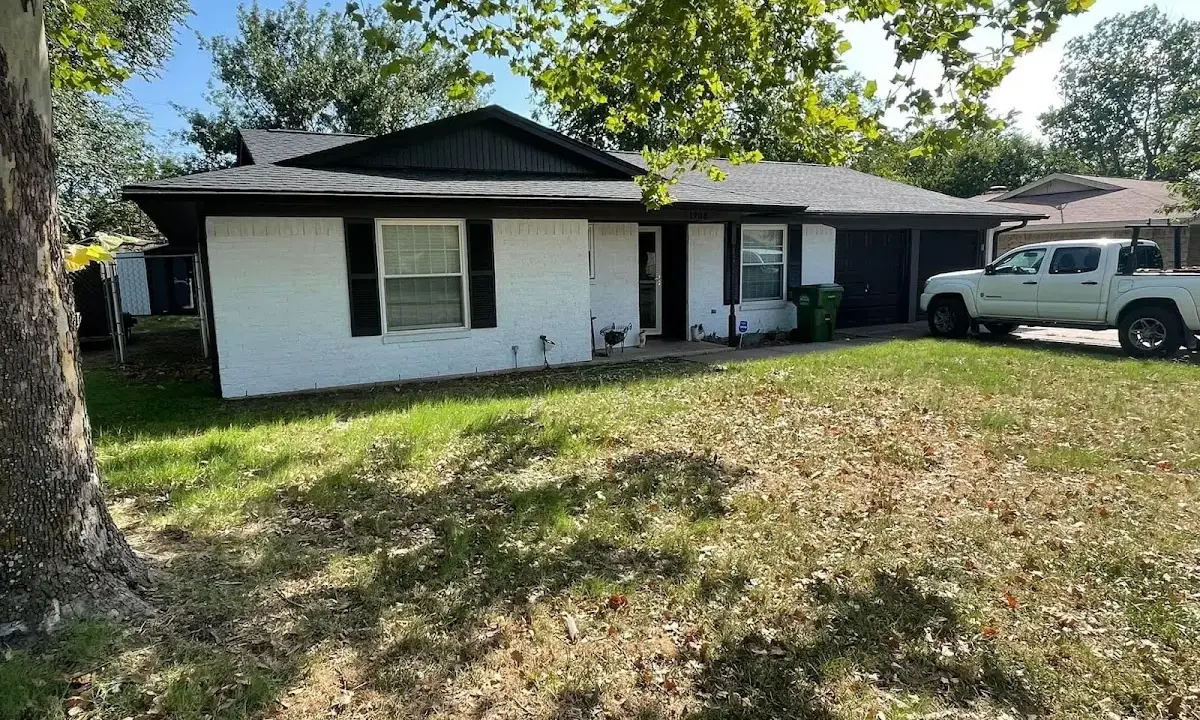 Professional roofing crew working on a residential roof in West Hartford